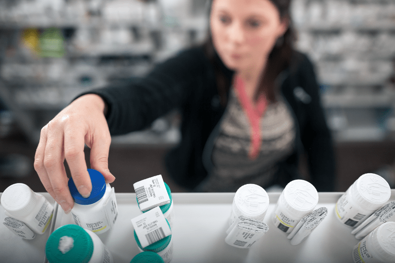 Woman reaching for bottle